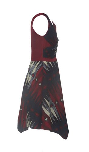 Side view of African wax handkerchief dress showing fitted bodice and asymmetric skirt – AfriBloom
