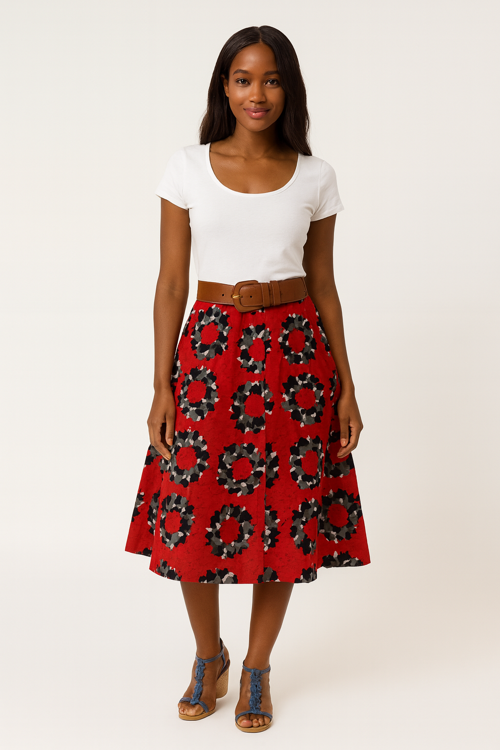 African-inspired red wax midi skirt with circular print worn by a woman, afro-fusion fashion handmade in Belgium.