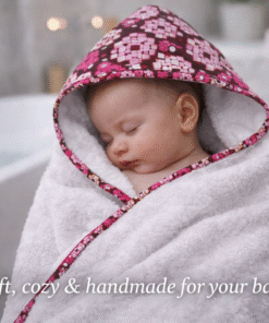 Baby wrapped in a handmade hooded towel after bath, African wax print baby nursery set, soft and cozy newborn essentials by AfriBloom