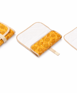 Foldable baby changing mat with African print exterior and wipeable lining