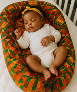 Handmade baby nest with customizable AfriBloom fabric, soft padded edges and cozy newborn cocoon design