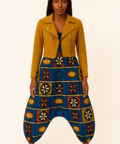 African woman wearing AfriBloom baggy harem pants with deep drop crotch, front view. Harem pants in African wax print styled with mustard jacket.