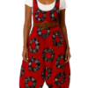 African woman wearing a deep-crotch harem jumpsuit with AfriBloom print, front view.