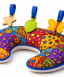 Handmade African patchwork tummy time pillow with sensory toys for babies, ergonomic newborn support cushion by AfriBloom