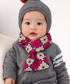 Baby wearing a soft African print scarf, styled comfortably around the neck, handmade baby fashion accessory.