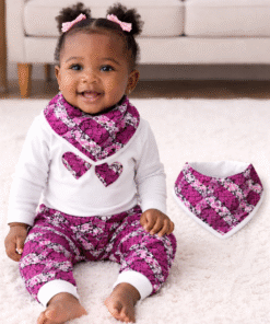 African baby girl wearing handmade Afro-fusion outfit with matching bandana bib in wax print, MiniBloom baby set by AfriBloom
