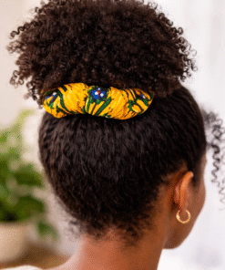 AfriBloom wax scrunchie worn in natural curly hair bun, handmade African print hair accessory