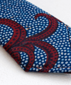 Close-up of handmade wax print necktie showing stitching, fabric texture, and premium finish