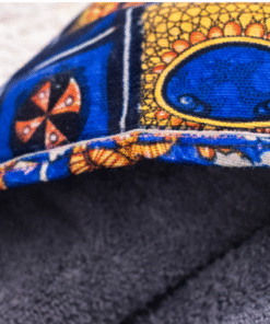 Close-up of AfriBloom baby hooded towel with African wax print trim and soft absorbent fabric