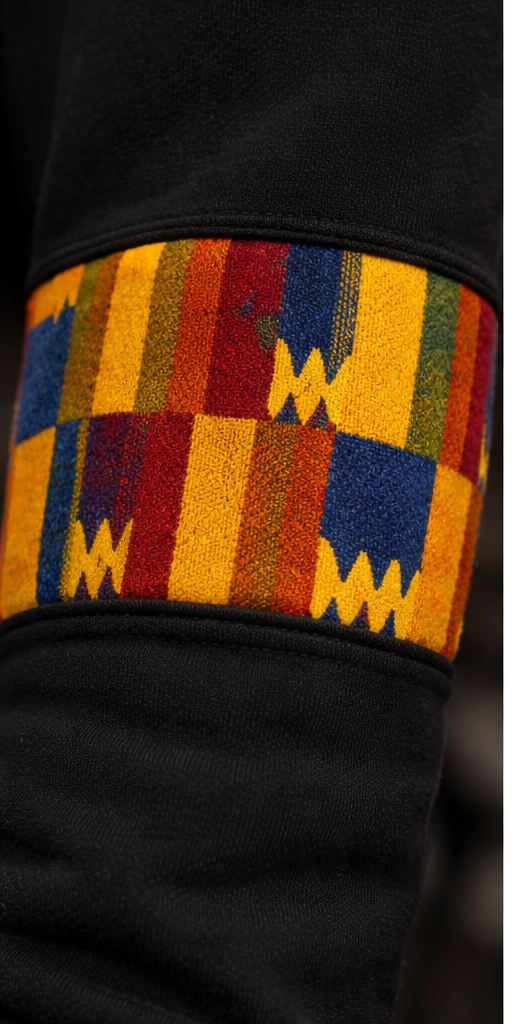 Close-up of African print sleeve detail on Afro Triangle men’s sweatshirt