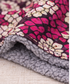 Soft fleece-lined African print baby scarf close-up, warm and cozy handmade baby accessory