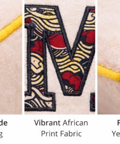 Handmade personalized baby cushion with African print appliqué initial, detailed stitching and yellow edge finishing