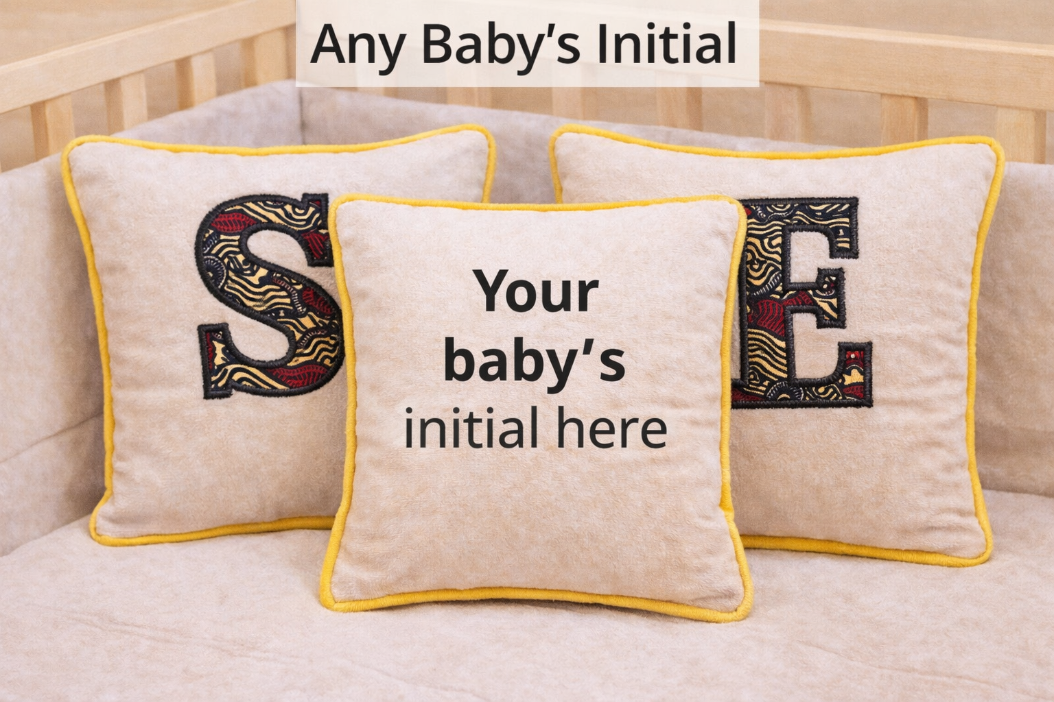 Personalized baby cushion with African print appliqué showing custom initials, handmade nursery pillow gift