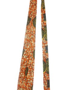 Handmade African wax print necktie by AfriBloom, laid flat showing pointed tip and vibrant Ankara pattern, ethical men’s accessory made in Belgium