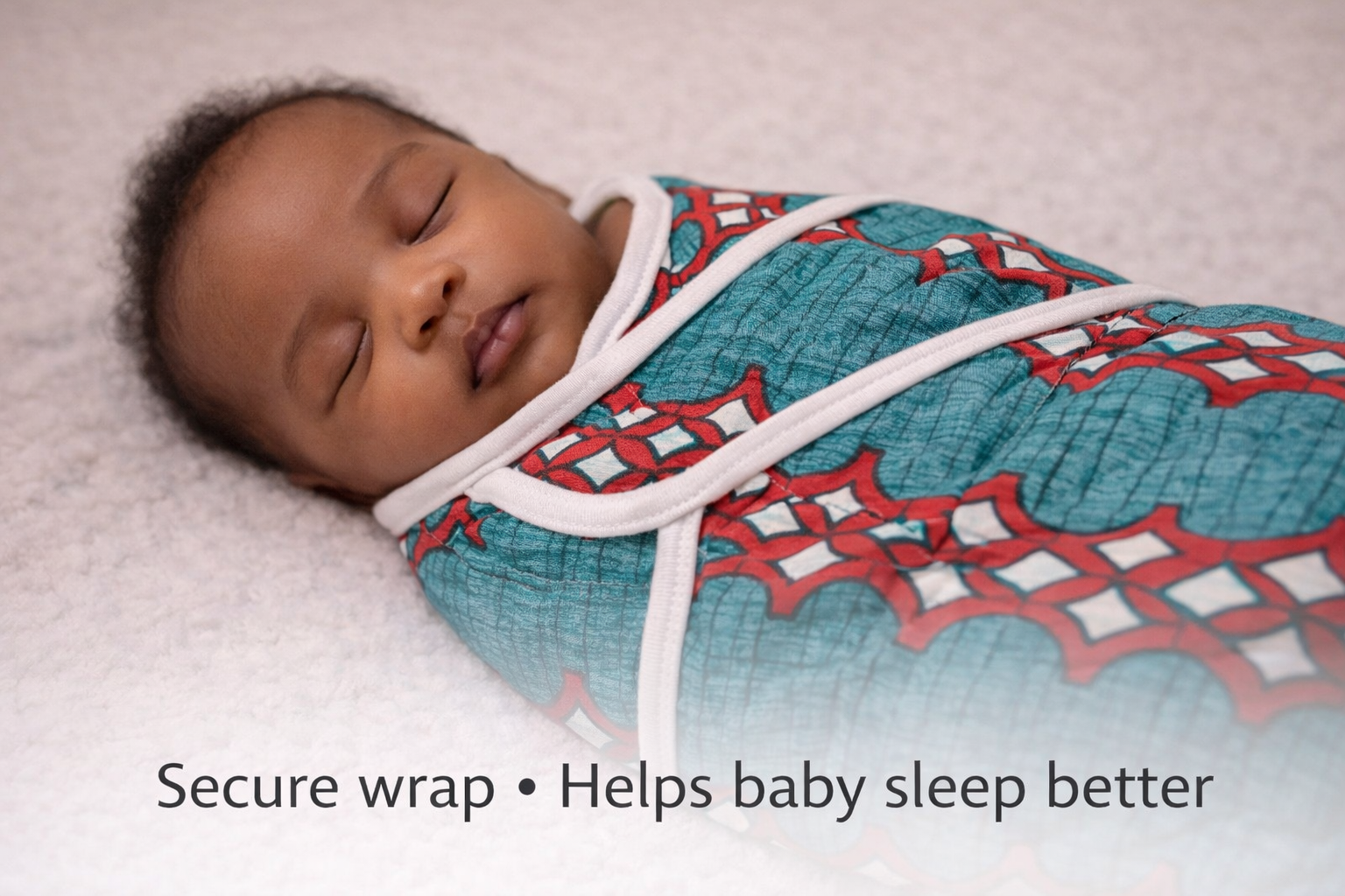 Secure African print baby swaddle helping newborn sleep better, breathable cotton handmade wrap for safe sleep