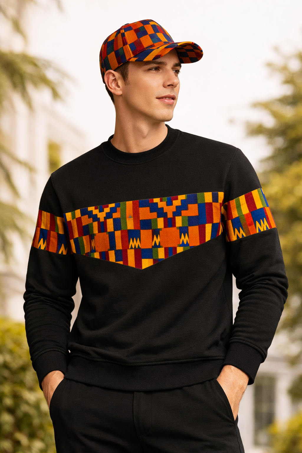 Man wearing Triangle Unity African print sweatshirt and matching cap outdoor lifestyle