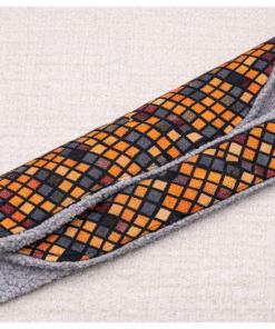 Handmade unisex African print scarf with soft fleece lining shown in flat lay on neutral background