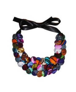 Handmade African statement necklace made from colorful wax print fabric buttons on ribbon tie